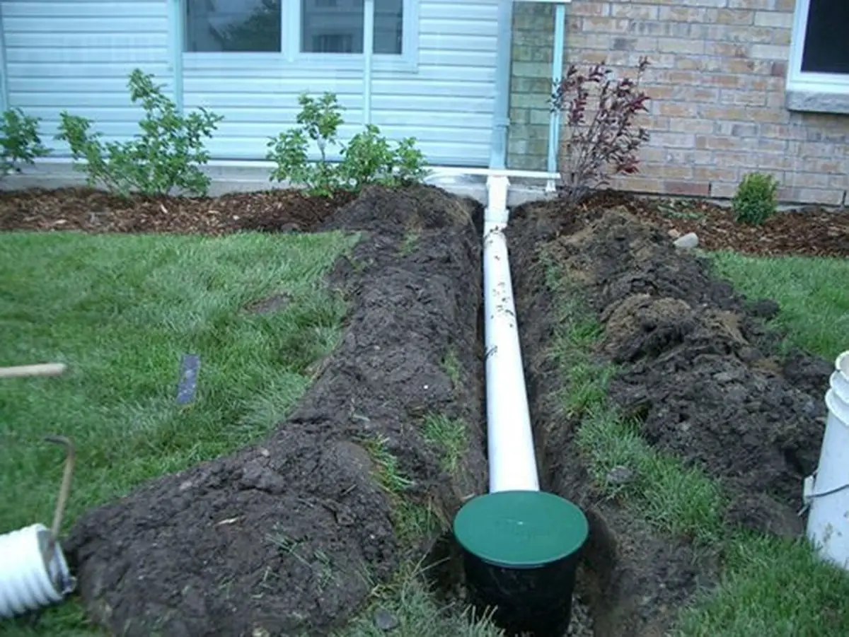 Downspout extension trenched away from the foundation